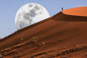 Dune walking in the Namib Desert at Sossusvlei in Namibia - obrazy, fototapety, plakaty