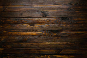 Naklejka premium Natural rustic wood background. Wood texture. Table of blank dark rustic planks top flat lay view.
