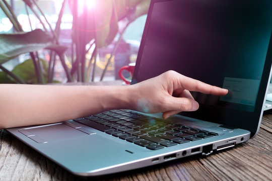 the point figer touching the laptop screen for inputing the network security key