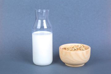 Healthy Breakfast with Muesli Cereal in Bowl and Milk in Bottle