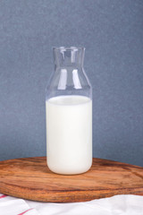 Single Milk in Bottle on Dark Background