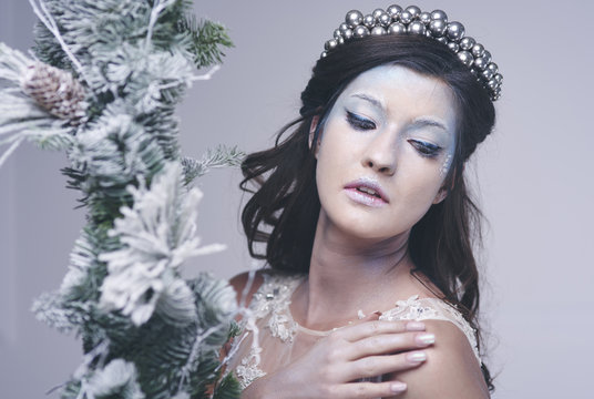 Pretty woman in frosty make up at studio shot