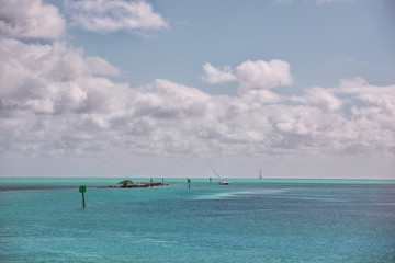 The Gulf of the Atlantic Ocean. A lonely sailing boat on the shallows. Florida. Ki West. Turquoise water and space.
