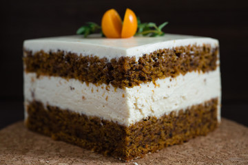 a piece of carrot cake with cream cheese