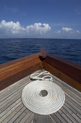 Coil of rope at the bow of a yacht - Maldives