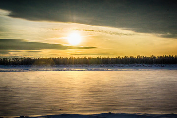 sunset on the river in winter