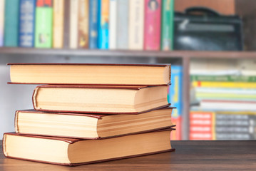 Books on the background of the shelf