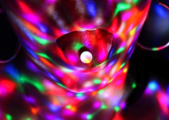 A young woman has ecstasy on her tongue in a night club.