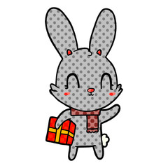 cute cartoon rabbit with christmas present