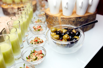    Interesting dishes and olives in a plates