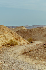 Fototapeta na wymiar View on dry desert sunny land near dead sea in Israel