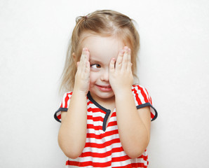 Funny little girl that cheats in hide and seek game