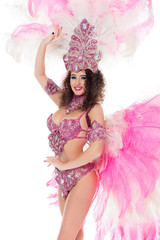 happy girl posing in carnival costume with pink feathers, isolated on white