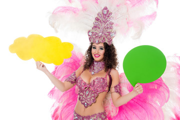 woman in carnival costume holding yellow empty text balloon and another one green, isolated on white