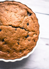 Banana bread with blueberries on a wooden table