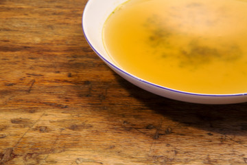 plate with soup on rustic wooden table