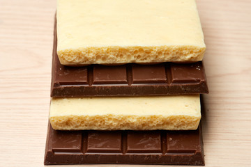 stack of dark and white chocolate closeup