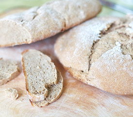 Loaf of homemade freshly baked bread on the table