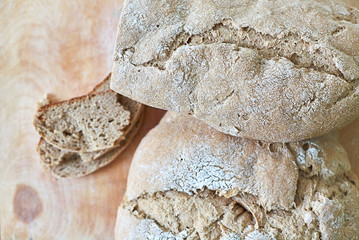 Homemade freshly baked bread on wooden table