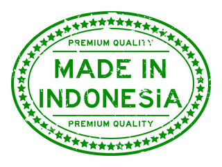 Grunge green premium quality made in Indonesia oval rubber seal stamp on white background