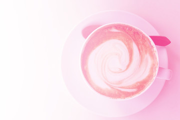 Cup of Cafe Latte or Capuccino  in pink color tone with morning light effect. For Valentine's Day festival