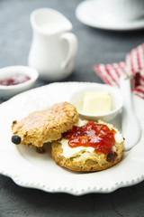 Fresh homemade scones with butter and jam