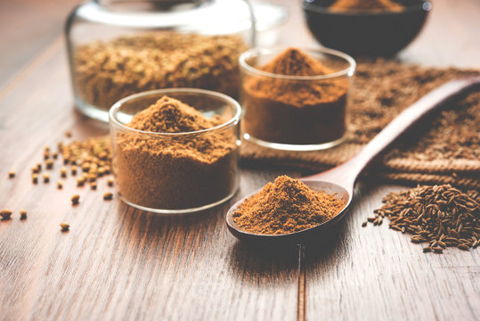 Indian spice coriander powder and cumin or jeera powder powder heap, selective focus

