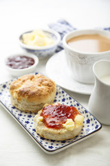 Fresh homemade scones with butter and jam