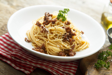 Homemade Bolognese pasta with grated cheese