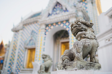 Fototapeta na wymiar Carving stone lion in Chinese style is popular used to show around Buddhism temple in Thailand.