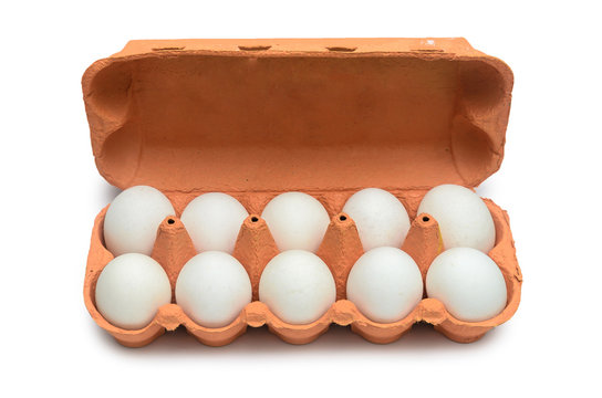 White chicken eggs in a cardboard container for storage and transportation