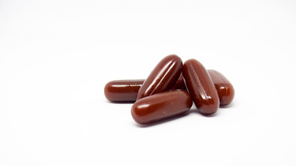 Brown pill with white background.