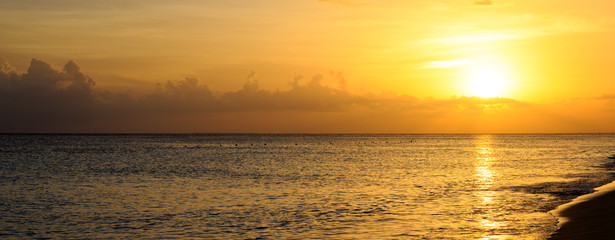 Golden sunrise sunset over the sea ocean.