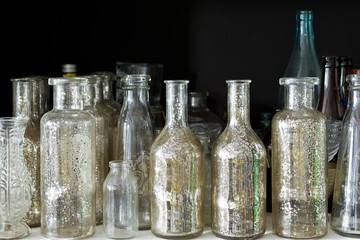 Many small glass medical bottles.