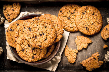 Oatmeal cookies with chocolate in a bowl.