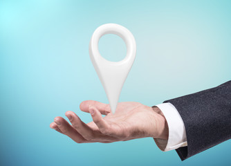 Businessman holding indicating location icon.