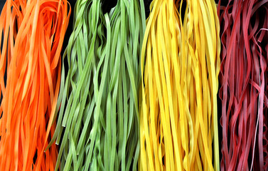 Colorful pasta on a black background

