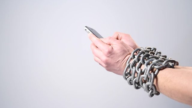  Nomophobia, chained hands with phone