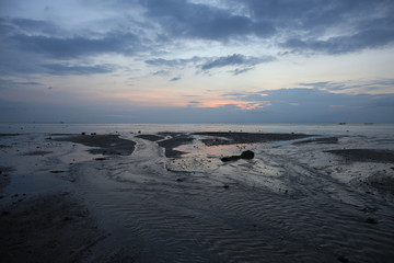 In the evening there are many sea water flows and beautiful blue sky.