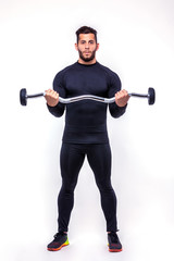 fitness man with sports bar on a light background