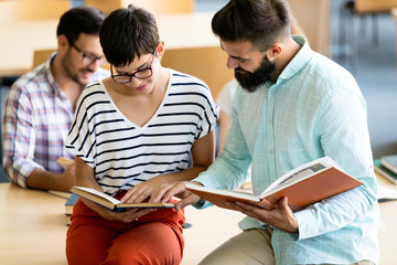 Group of college students working together in the school