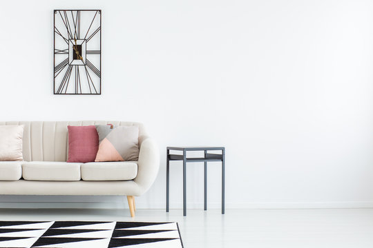 White room with basic furniture