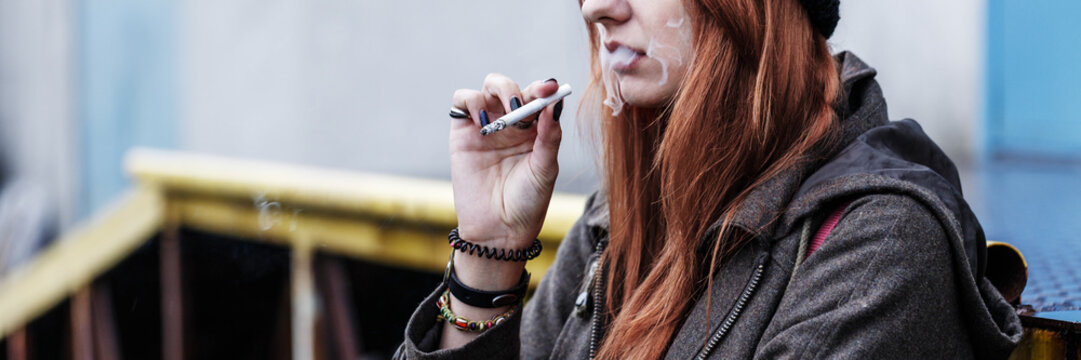 Close-up of teenager smoking cigarette