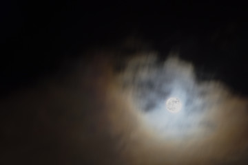 Naklejka na ściany i meble Full moon in the sky with clouds at night. 