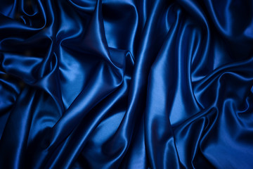 Blue fabric background and texture, Grooved of dark blue satin abstract