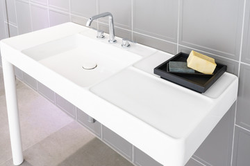 Interior of bathroom with sink basin faucet and mirror. Modern design of bathroom