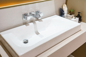 Interior of bathroom with sink basin faucet and mirror. Modern design of bathroom