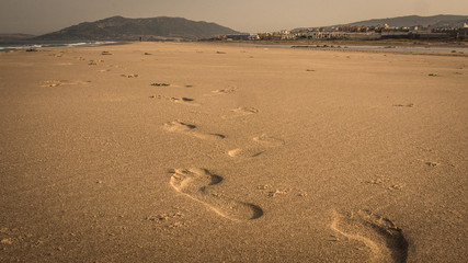 Fototapeta na wymiar foot prints in the sand