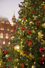Big Christmas tree with balls and ornaments near the Historical Museum in Moscow on the red square