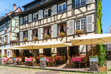 Fototapeta na wymiar Cafes and restaurant in Petite-France in Strasbourg, Traditional colorful houses in La Petite France, Strasbourg, Alsace, France